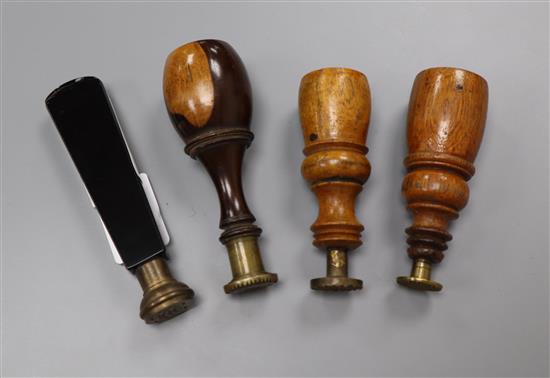 Three 19th century lignum vitae handled desk seals and a black glass handled seal